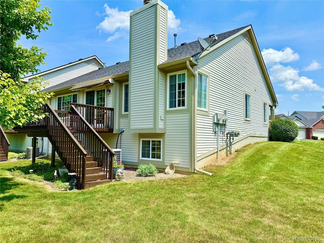 6426 Club Ct W, Grand Blanc, MI 48439 - back of house with stairs, a chimney, a wooden deck, and a yard
