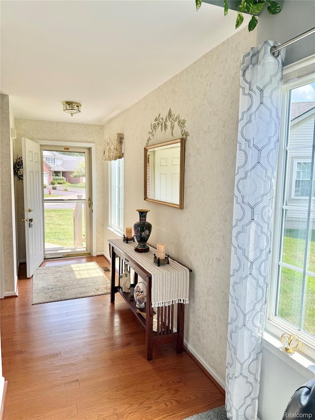 6426 Club Ct W, Grand Blanc, MI 48439 - entrance foyer with healthy amount of natural light and light wood finished floors