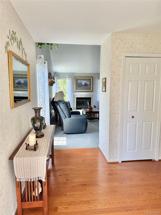 6426 Club Ct W, Grand Blanc, MI 48439 - corridor with wood finished floors, wallpapered walls, and a textured wall
