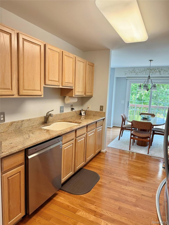 6426 Club Ct W, Grand Blanc, MI 48439 - kitchen featuring stainless steel dishwasher, light brown cabinetry, light wood-type flooring, pendant lighting, and light stone counters