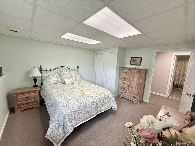 6426 Club Ct W, Grand Blanc, MI 48439 - carpeted bedroom featuring a paneled ceiling and a closet