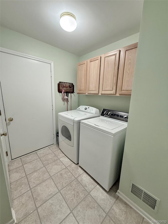 6426 Club Ct W, Grand Blanc, MI 48439 - laundry room featuring washing machine and dryer, cabinet space, and light tile patterned floors