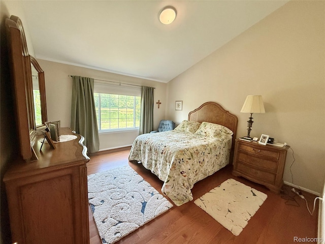 6426 Club Ct W, Grand Blanc, MI 48439 - bedroom featuring wood finished floors and lofted ceiling