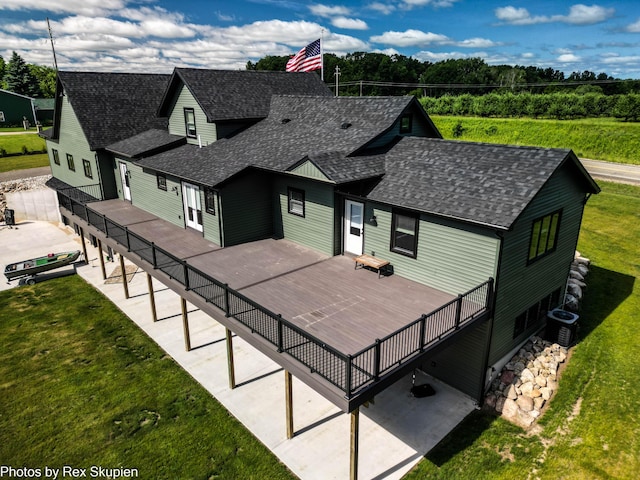 17090 Kenowa Ave, Kent City, MI 49330 - view of front of home with roof with shingles, a front lawn, and a wooden deck