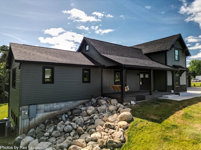 17090 Kenowa Ave, Kent City, MI 49330 - rear view of property featuring a shingled roof and a yard
