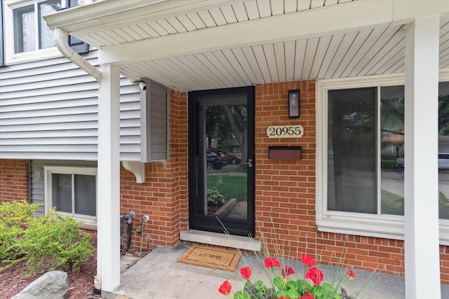 20955 Robinwood St, Farmington, MI 48336 - doorway to property with brick siding