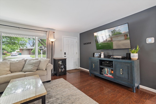 20955 Robinwood St, Farmington, MI 48336 - living area featuring dark wood-type flooring and baseboards