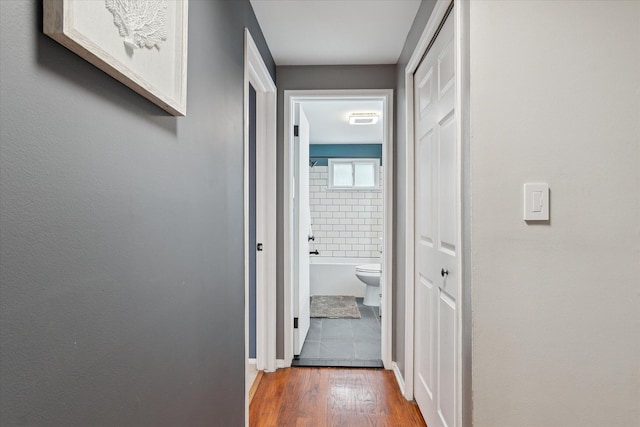20955 Robinwood St, Farmington, MI 48336 - hallway with dark wood-style flooring and baseboards