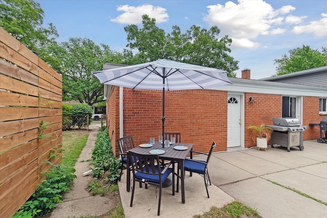 20955 Robinwood St, Farmington, MI 48336 - view of patio featuring a grill and outdoor dining space