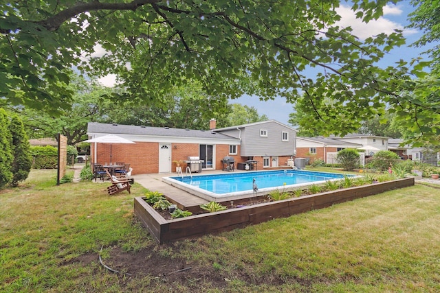 20955 Robinwood St, Farmington, MI 48336 - view of pool featuring area for grilling and a fenced backyard