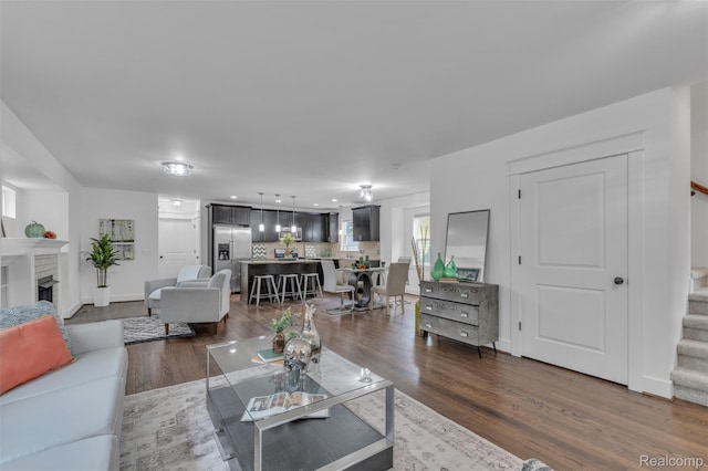 715 Gardenia Ave, Royal Oak, MI 48067 - living area featuring stairs, a fireplace, and wood finished floors
