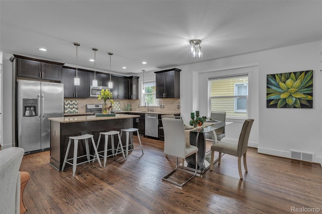 715 Gardenia Ave, Royal Oak, MI 48067 - dining space with recessed lighting and dark wood-style floors