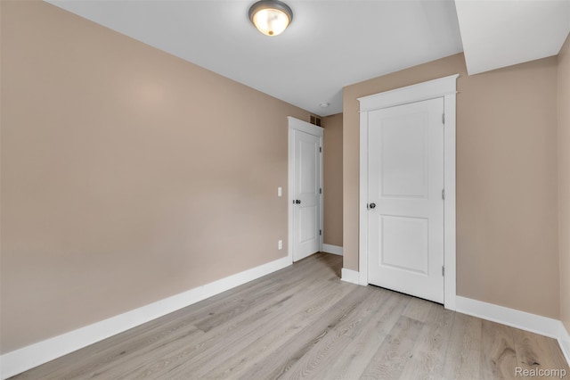 715 Gardenia Ave, Royal Oak, MI 48067 - unfurnished bedroom with light wood-style flooring