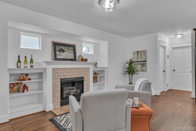 715 Gardenia Ave, Royal Oak, MI 48067 - living area with dark wood-type flooring and a brick fireplace