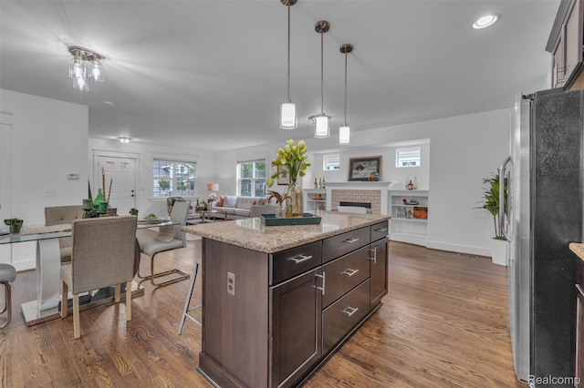 715 Gardenia Ave, Royal Oak, MI 48067 - kitchen with freestanding refrigerator, open floor plan, dark brown cabinetry, dark wood-style flooring, and recessed lighting