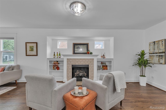 715 Gardenia Ave, Royal Oak, MI 48067 - living area with dark wood finished floors and a fireplace