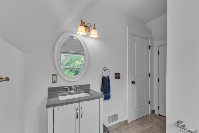 715 Gardenia Ave, Royal Oak, MI 48067 - bathroom with vanity, vaulted ceiling, and tile patterned flooring