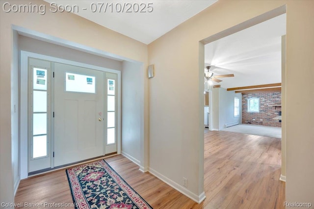 1526 Rulane Dr, Lapeer, MI 48446 - entryway featuring wood finished floors, a ceiling fan, and brick wall