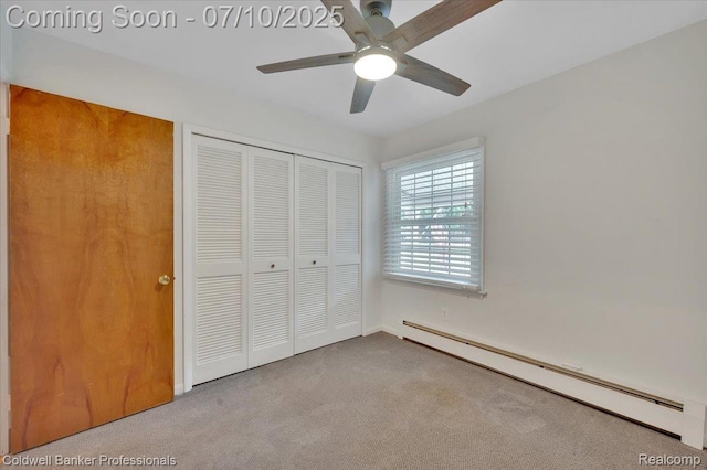 1526 Rulane Dr, Lapeer, MI 48446 - unfurnished bedroom with a baseboard heating unit, carpet flooring, a closet, and a ceiling fan