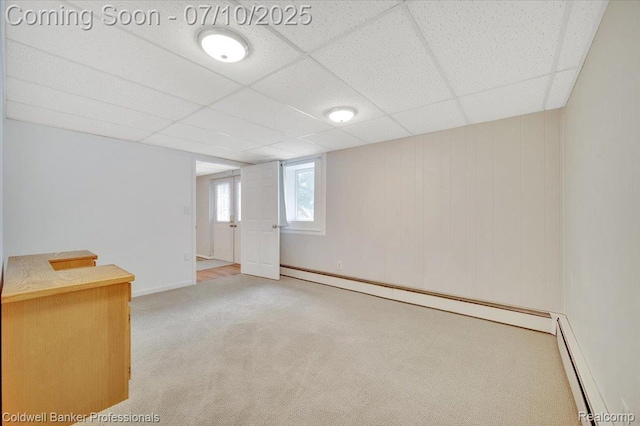 1526 Rulane Dr, Lapeer, MI 48446 - basement with a baseboard radiator, carpet flooring, and a paneled ceiling