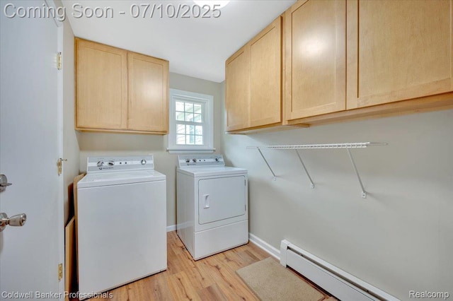 1526 Rulane Dr, Lapeer, MI 48446 - laundry room with cabinet space, a baseboard radiator, washing machine and dryer, and light wood-style floors