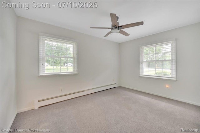 1526 Rulane Dr, Lapeer, MI 48446 - carpeted empty room featuring a baseboard radiator and a ceiling fan
