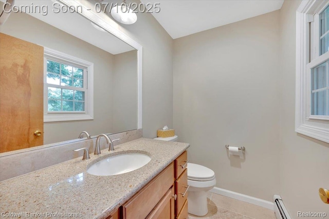1526 Rulane Dr, Lapeer, MI 48446 - bathroom with vanity, a baseboard heating unit, and tile patterned flooring