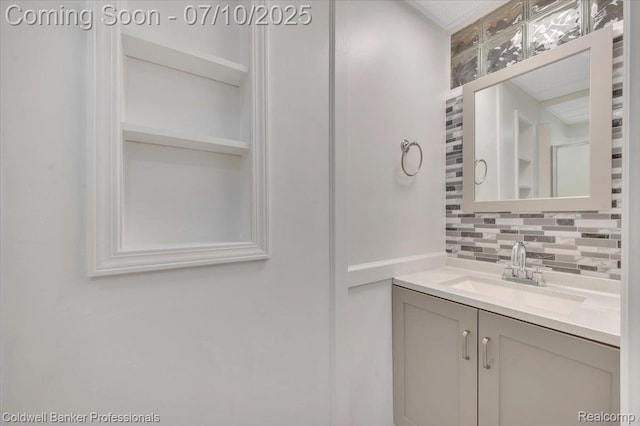 1526 Rulane Dr, Lapeer, MI 48446 - bathroom featuring decorative backsplash and vanity