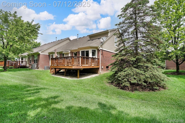1128 Andover Cir, Commerce Twp, MI 48390 - back of house featuring brick siding, a deck, a lawn, and roof with shingles