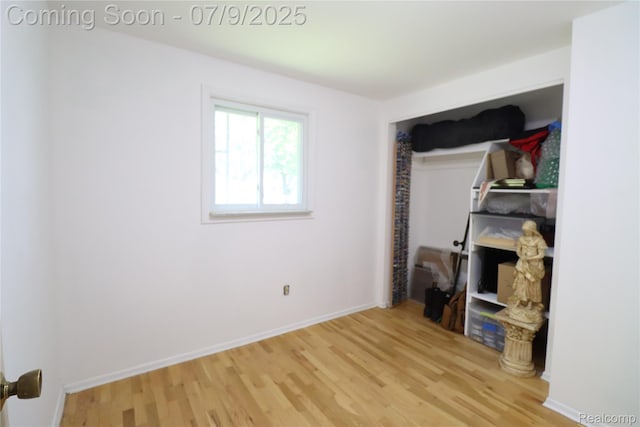 9360 Gale Rd, Goodrich, MI 48438 - unfurnished bedroom with wood finished floors and baseboards