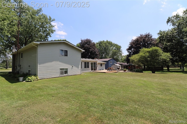 9360 Gale Rd, Goodrich, MI 48438 - back of property with a yard and a wooden deck