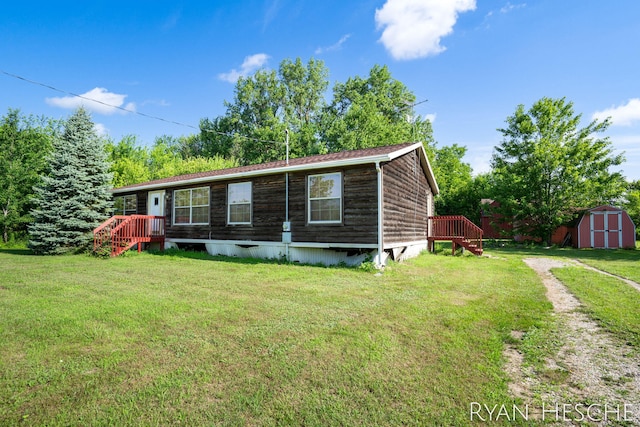 5886 W Clarksville Rd, Lake Odessa, MI 48849 - manufactured / mobile home with a storage unit and a front yard