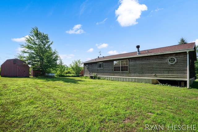 5886 W Clarksville Rd, Lake Odessa, MI 48849 - view of grassy yard featuring an outdoor structure