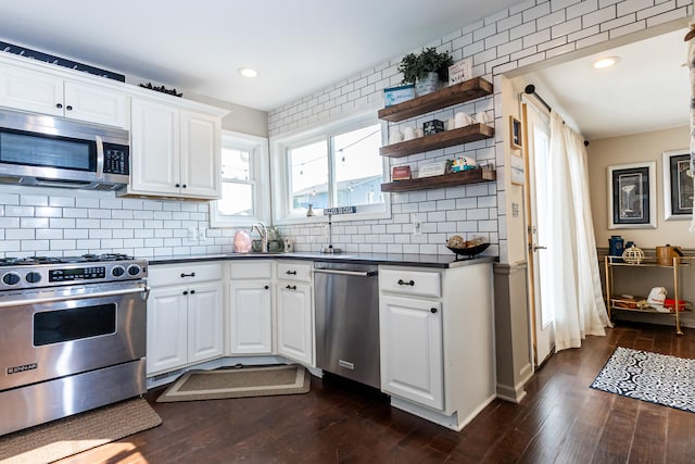 22515 E 10 Mile Rd, Saint Clair Shores, MI 48080 - kitchen with appliances with stainless steel finishes, dark countertops, dark wood-type flooring, open shelves, and white cabinetry