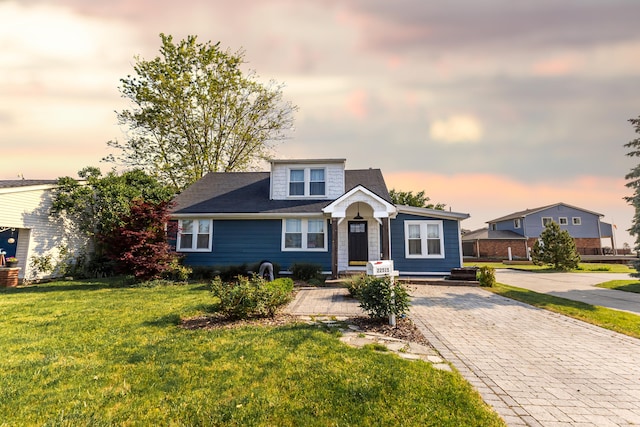 22515 E 10 Mile Rd, Saint Clair Shores, MI 48080 - view of front of house featuring a front lawn and decorative driveway
