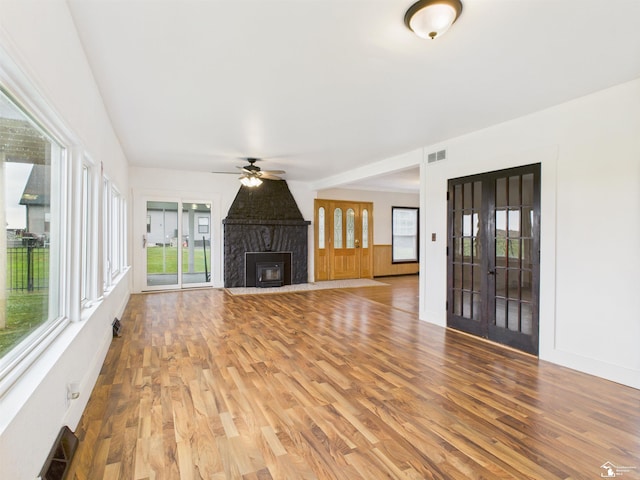 4356 14th St, Luna Pier, MI 48157 - unfurnished living room featuring ceiling fan, wood finished floors, and a fireplace