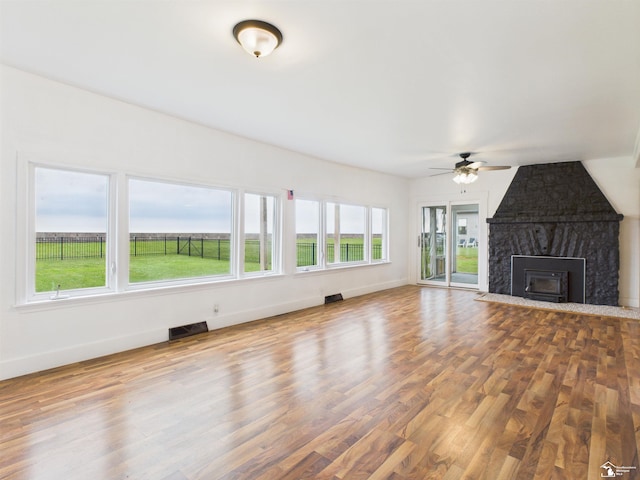 4356 14th St, Luna Pier, MI 48157 - unfurnished living room featuring ceiling fan, wood finished floors, and a fireplace