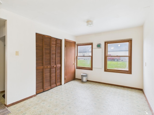 4356 14th St, Luna Pier, MI 48157 - unfurnished bedroom with multiple closets and light floors