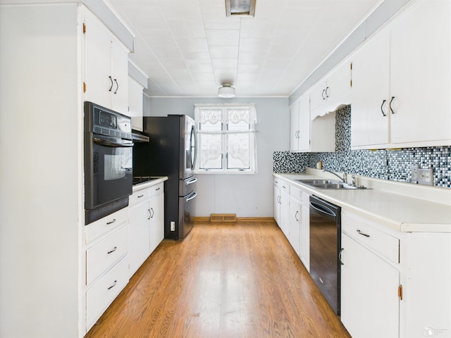 4356 14th St, Luna Pier, MI 48157 - kitchen featuring dishwasher, oven, freestanding refrigerator, light countertops, and light wood-style flooring