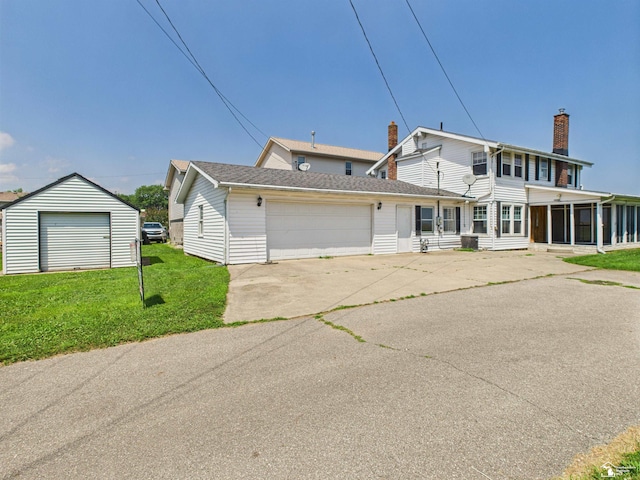 4356 14th St, Luna Pier, MI 48157 - view of front facade featuring a sunroom, a front yard, a chimney, and an attached garage