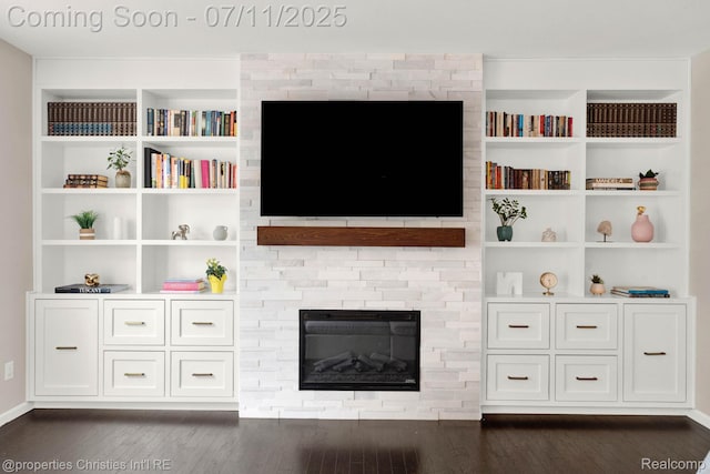 2962 Iowa Dr, Troy, MI 48083 - unfurnished living room with dark wood-style flooring, a fireplace, and built in shelves
