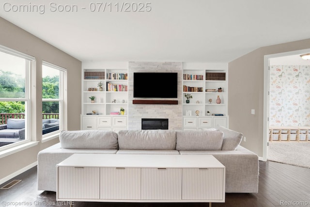 2962 Iowa Dr, Troy, MI 48083 - living area with dark wood-style floors, a fireplace, and built in features