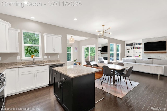 2962 Iowa Dr, Troy, MI 48083 - kitchen with stainless steel appliances, open floor plan, white cabinetry, dark cabinets, and recessed lighting