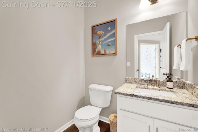 2962 Iowa Dr, Troy, MI 48083 - half bathroom featuring vanity and wood finished floors