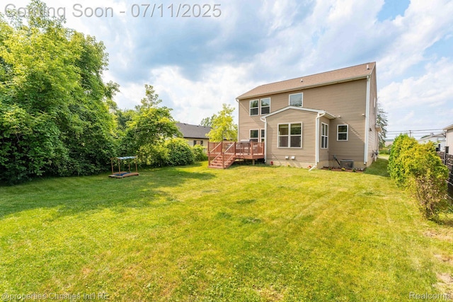 2962 Iowa Dr, Troy, MI 48083 - rear view of house with a deck and a lawn