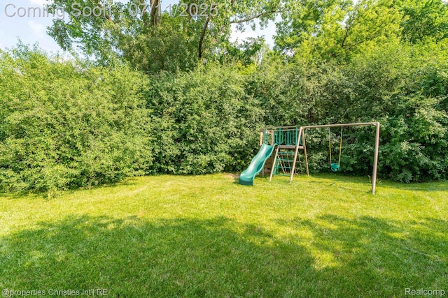 2962 Iowa Dr, Troy, MI 48083 - view of green lawn featuring a playground
