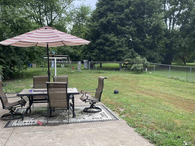15427 Keegan Rd, Monroe, MI 48161 - view of yard featuring outdoor dining space, a patio, a playground, and view of scattered trees