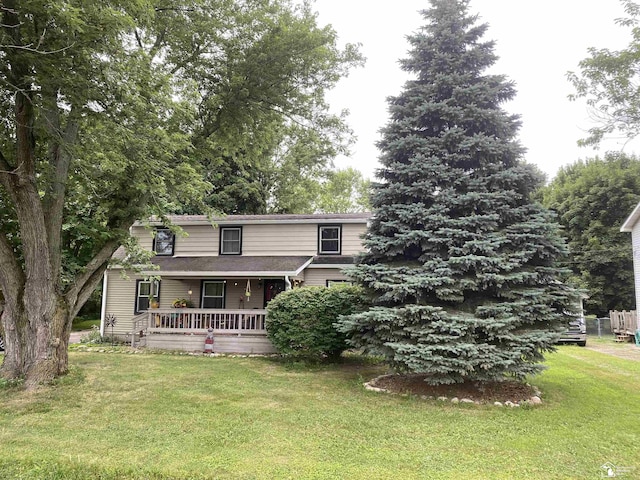 15427 Keegan Rd, Monroe, MI 48161 - traditional-style house with a front yard and covered porch