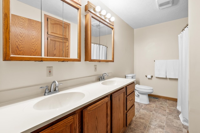 22100 N Uldriks Dr, Battle Creek, MI 49017 - bathroom with double vanity and stone finish flooring