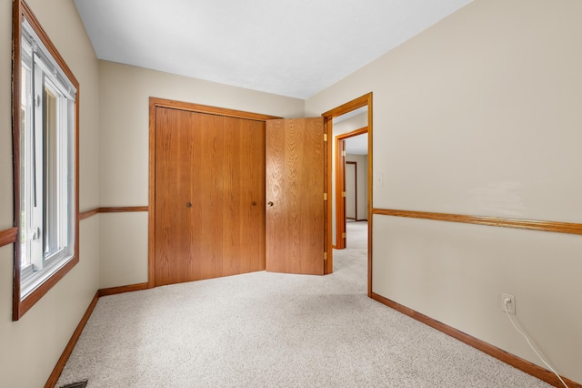 22100 N Uldriks Dr, Battle Creek, MI 49017 - unfurnished bedroom featuring carpet flooring and a closet